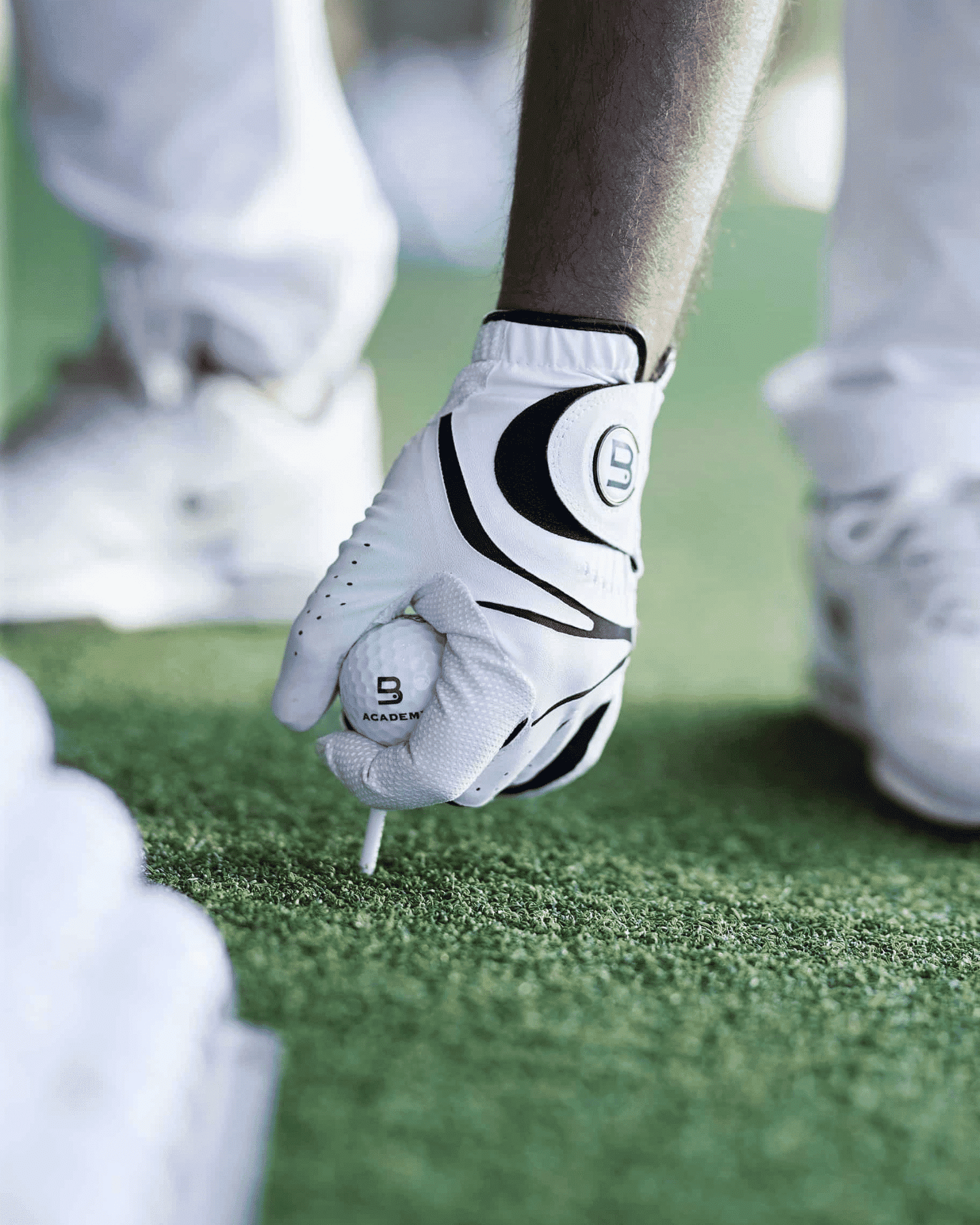 Hand of a man holding golf ball