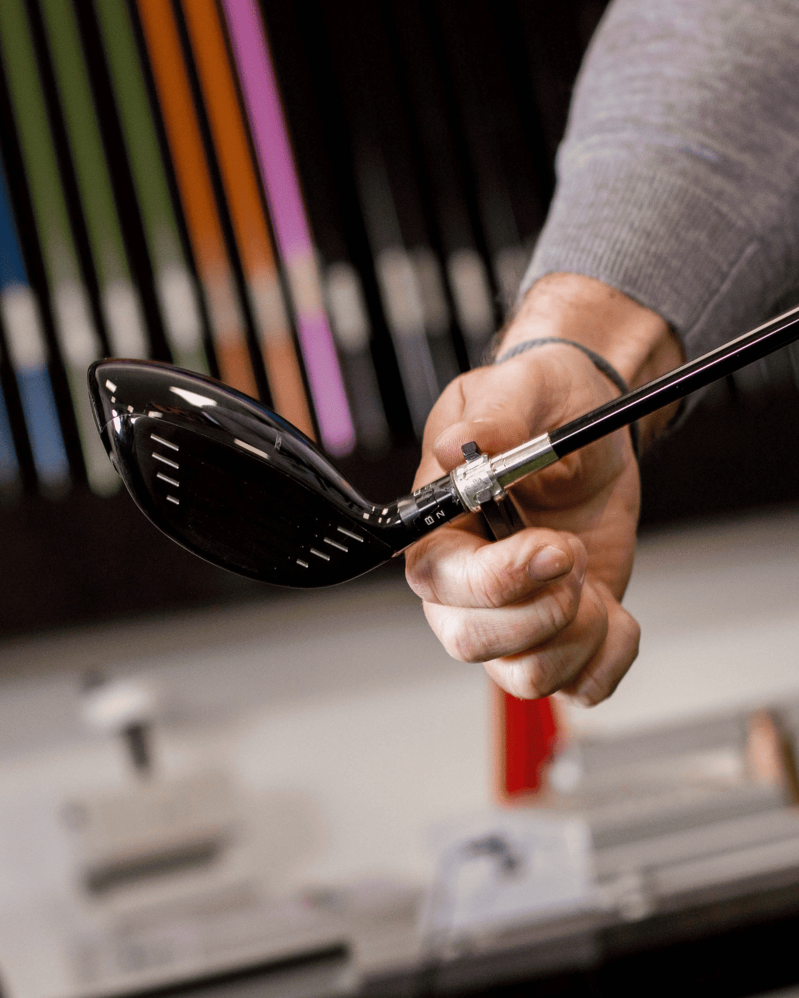 hand of a man holding golf club